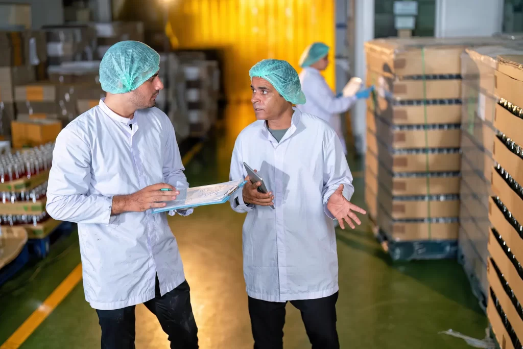 Team ensuring food safety compliance using insulated thermal covers in cold chain logistics
