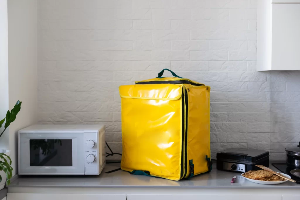 Heavy-duty insulated IBC tank cover with silver foil for temperature-sensitive industrial liquids.